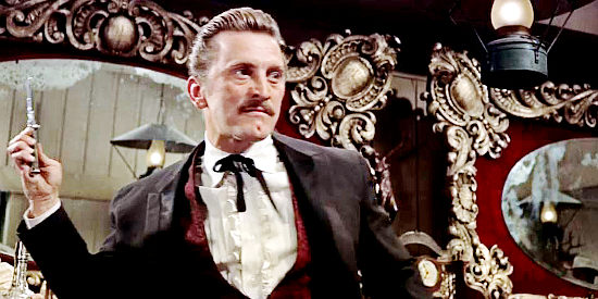 Kirk Douglas as Doc Holliday, as deadly with a knife as with a gun in Gunfight at the O.K. Corral (1957)