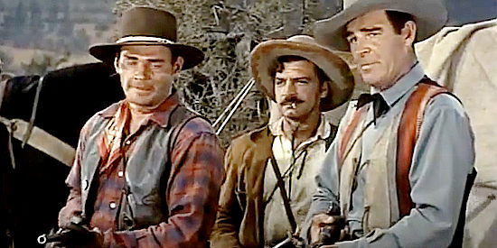 Leo Gordon as Tuss McLawery, Anthony Caruso as Chavez and Rod Cameron as Jess Griswold confronting a suspected traitor in Sante Fe Passage (1955)