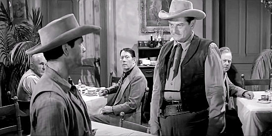 Luke Welch (Charles Bronson) confronting Con Maynor (Thomas Henry) about being wanted in Showdown at Boot Hill (1958)