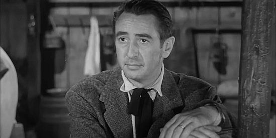 Macdonald Carey as Hollis Jarrett, wise to who has landed on his doorstep and accepting it as a challenge in Stranger at My Door (1956)