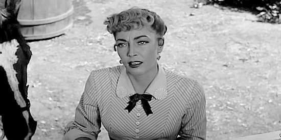 Marie Windsor as Karen Childress, warning Sheriff Leech of the killers who have arrived in Boyce in The Silver Star (1955)