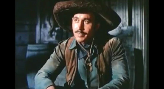 Michael Ansara as Apache Joe, leader of an outlaw gang planning a $50,000 train robbery in Three Young Texans (1954)