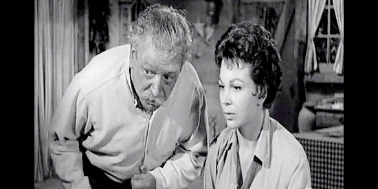 Michael Vallon as Senor Salvador and Pamela Duncan as his daughter Maria, nursing a wounded Jay Turner in Gun Battle at Monterey (1957)