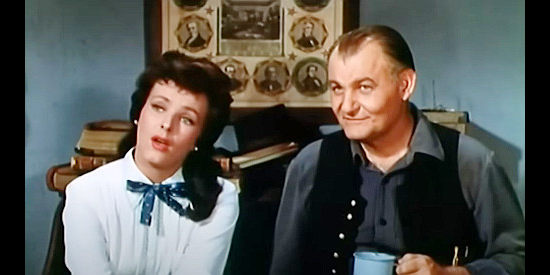 Miroslava as Amy Lee Bannerman and Emile Meyer as Sheriff Bell, marveling over the judge's determination in Stranger on Horseback (1955)