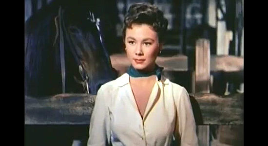 Mitzi Gaynor as Rusty Blair, confused as to why Johnny Colt would rob a train in Three Young Texans (1954)