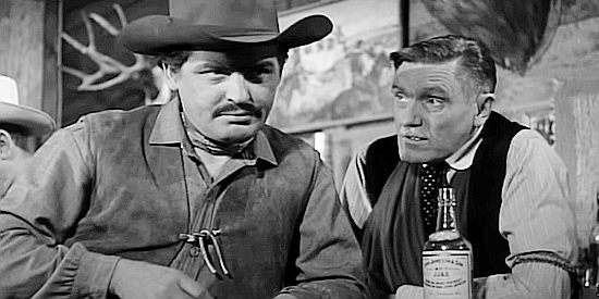 Morris Ankrum (right) as saloon owner Charlie Childress with hired gun King Daniels (Richard Bartlett) in The Silver Star (1955)