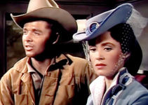 Audie Murphy as Reb Kittridge and Susan Cabot as Rita Saxon in Gunsmoke (1953)