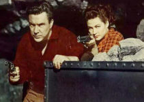 Edmund O'Brien as Larkin Moffatt and Yvonne De Carlo as Candace Surrency defending the mine in Silver City (1951)