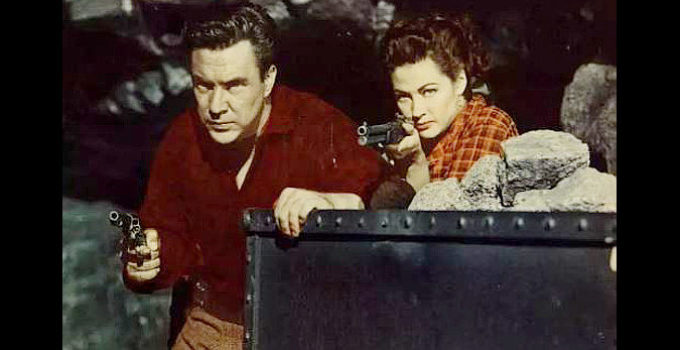 Edmund O'Brien as Larkin Moffatt and Yvonne De Carlo as Candace Surrency defending the mine in Silver City (1951)