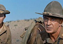 Gary Cooper as Maj. Thomas Thorn, watching the U.S. cavalry attack at the Geary ranch as Pvt. Andrew Hetherington (Mihcale Callan) looks on in They Came to Cordura (1959)