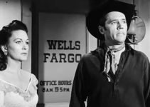 Gloria McGehee as Meg Anderson and Howard Duff as Jess Collins, worried trouble is coming to Colton in Sierra Stranger (1957)