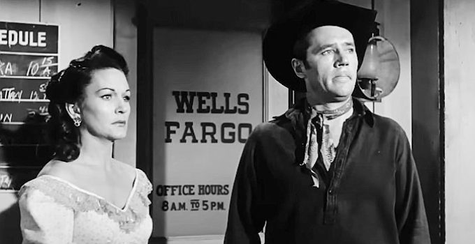 Gloria McGehee as Meg Anderson and Howard Duff as Jess Collins, worried trouble is coming to Colton in Sierra Stranger (1957)