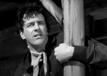 ames Arness as Rem Anderson, watching his partners ride off to leave him to face a posse alone in Gun the Man Down (1956)