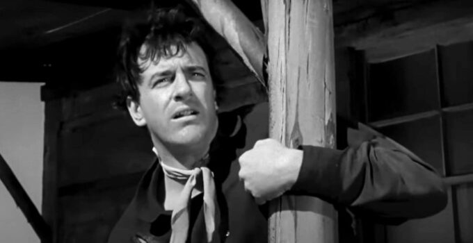 ames Arness as Rem Anderson, watching his partners ride off to leave him to face a posse alone in Gun the Man Down (1956)