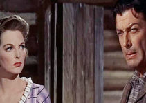 Julie London as Joan Blake and Robert Taylor as Steve Sinclair in Saddle the Wind (1958)