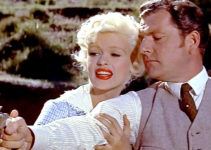 Kenneth Moore as Jonathan Tibbs with Jayne Mansfield as Kate in The Sheriff of Fractured Jaw (1958)
