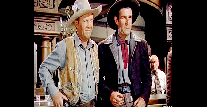 Wayne Morris as Barney Broderick and Rod Cameron as Grif Holbrook, standing tall together in Stage to Tucson (1950)