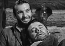 Zachary Scott as Johnny Greer with Jim Canfield (Glenn Ford) in a chokehold in The Secret of Convict Lake (1951)