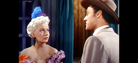 Peggy Maley as Sally, the showgirl who introduces Farraday to Brett Manning in The Siege at Red River (1954)