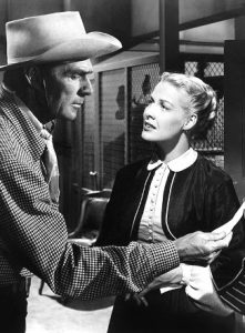 Randolph Scott as Britt Canfield and Janis Carter as Judith Chandler in ...