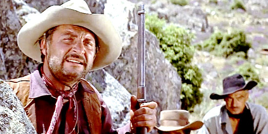 Reed De Rouen as Clayborne, one of the fueding ranchers in The Sheriff of Fractured Jaw (1958)