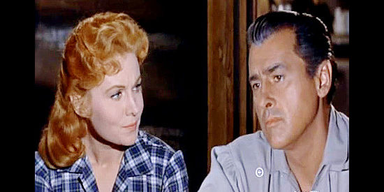 Rhonda Fleming as Jo and Stewart Granger as Tom Earley, sharing a quiet moment in Gun Glory (1957)