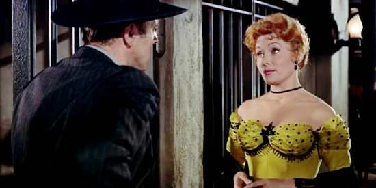 Rhonda Fleming as Laura Benbow, waiting for Wyatt Earp (Burt Lancaster) to lock her in a cell in Gunfight at the O.K Corral (957)