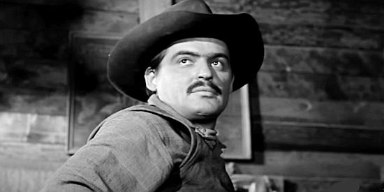Richard Bartlett, arriving at the Boyce saloon and announcing that he plans to kill the sheriff if the lawman doesn't leave town in The Silver Star (1955)