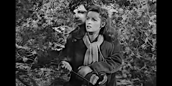 Richard Hylton as Clyde Maxwell, holding a knife to Barbara Purcell (Barbara Bates) in The Secret of Convict Lake (1951)