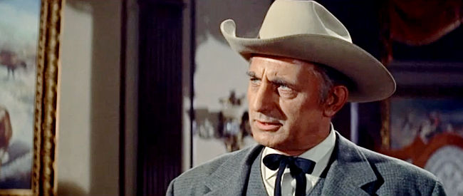 Robert Simon as Sheriff Harry Brill, face with trouble from the moment Ed Hackett hits town in Gunman's Walk (1958)