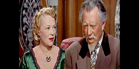 Sally Ellers as Annie Benson, an old fame of Grif Holbrook, with Dr. Noah Banteen (Carl Benton Reid), a southern sympathizer in Stage to Tucson (1950)