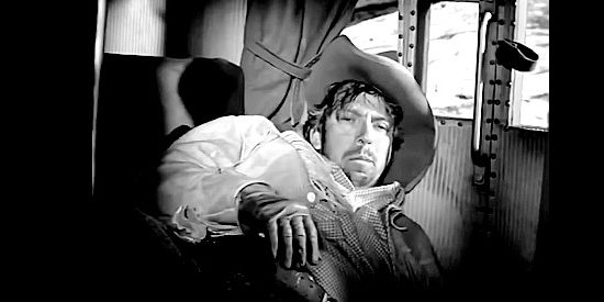 Slim Pickens as Hank Moss, a stage driver who gets drunk after a holdup in Gunsight Ridge (1957)