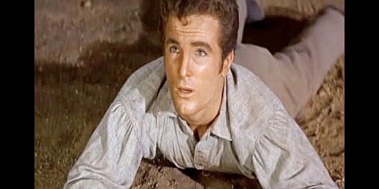 Steve Roland as Tom Earley Jr., trying to help his father out of trouble and winding up lying in the dirt in Gun Glory (1957)