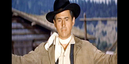Stewart Granger as Tom Earley, facing the fact that it's time for a showdown with cattleman Grimsell and his hired man Gunn in Gun Glory (1957)