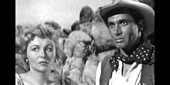 Vera Ralston as Cheel and Anthony George as Juan Morales, their relationship strained because of his cooperation with Pike in Gunfire at Indian Gap (1957)
