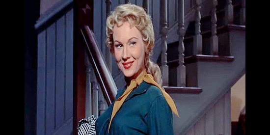 Virginia Mayo as dressmaker Ann Alaine, causing a stir upon her arrival in Denver in Great Day in the Morning (1956)