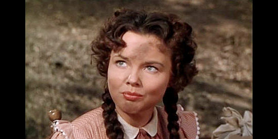 Wanda Hendrix as Della, the runaway Slim's four boys find while Chuck Conner is away in Saddle Tramp (1950)