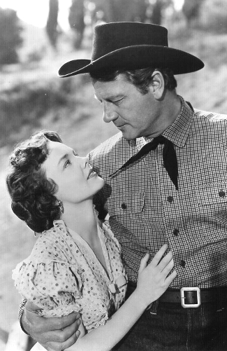 Wanda Hendrix as Della with Joel McCrea as Chuck Conner in Saddle Tramp (1950)