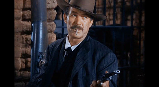 Ward Bond as Sheriff Jim Caradac, warning a stranger not to do too good a job as deputy in Singing Guns (1950)