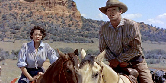 Yvonne De Carlo as Abby and Sterling Hayden as Clay Hardin, riding toward a showdown in Shotgun (1955)