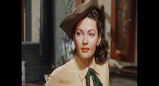 Yvonne De Carlo as Candace Surrency, turning on the charm in hopes of convincing Moffatt to become mine boss in Silver City (1951)