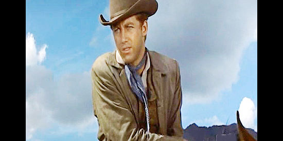 Don Dubbins as Steve Miller, arriving in Rodock valley and spotting a rancher in trouble in Tribute to a Bad Man (1956)