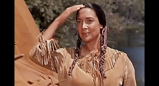 Joy Page as Prairie Flower, watching her son's proud return to camp with the wild horse he's tamed in Tonka (1956)