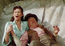 Yvonne De Carlo as Julie Madden, reacting when Dan Castello (Tom Tulley) is wounded in Tomahawk (`951)