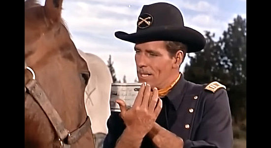 Philip Carey as Capt. Keough, showing Tonka, aka Comanche, his bill of sale in Tonka (1956)