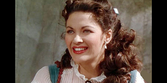 Yvonne De Carlo as Julie Madden, meeting Lt. Darcy for the first time in Tomahawk (1951)