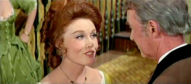 Elaine Devry as Pauline, introducing herself to John O'Hanlan (James Stewart) in The Cheyenne Social Club (1970)