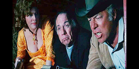 Henry Jones (center) as The Rev. Green, caught between a quarreling couple, Bell Nops (Anne Jackson) and Hoke Birdsill (George Kennedy) in Dirty Dingus Magee (1970)