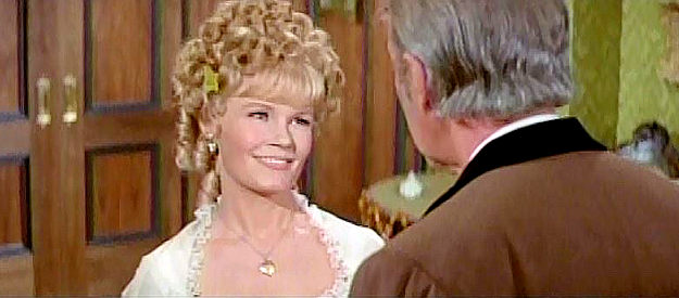 Jackie Russell as Carrie Virginia, explaining that her fiancee's brother has come calling in The Cheyenne Social Club (1970)
