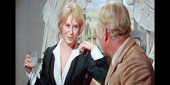 Lois Nettleton as Prudence Frost, warming up to Hoke Birdsill (George Kennedy) in Dirty Dingus Magee (1970)